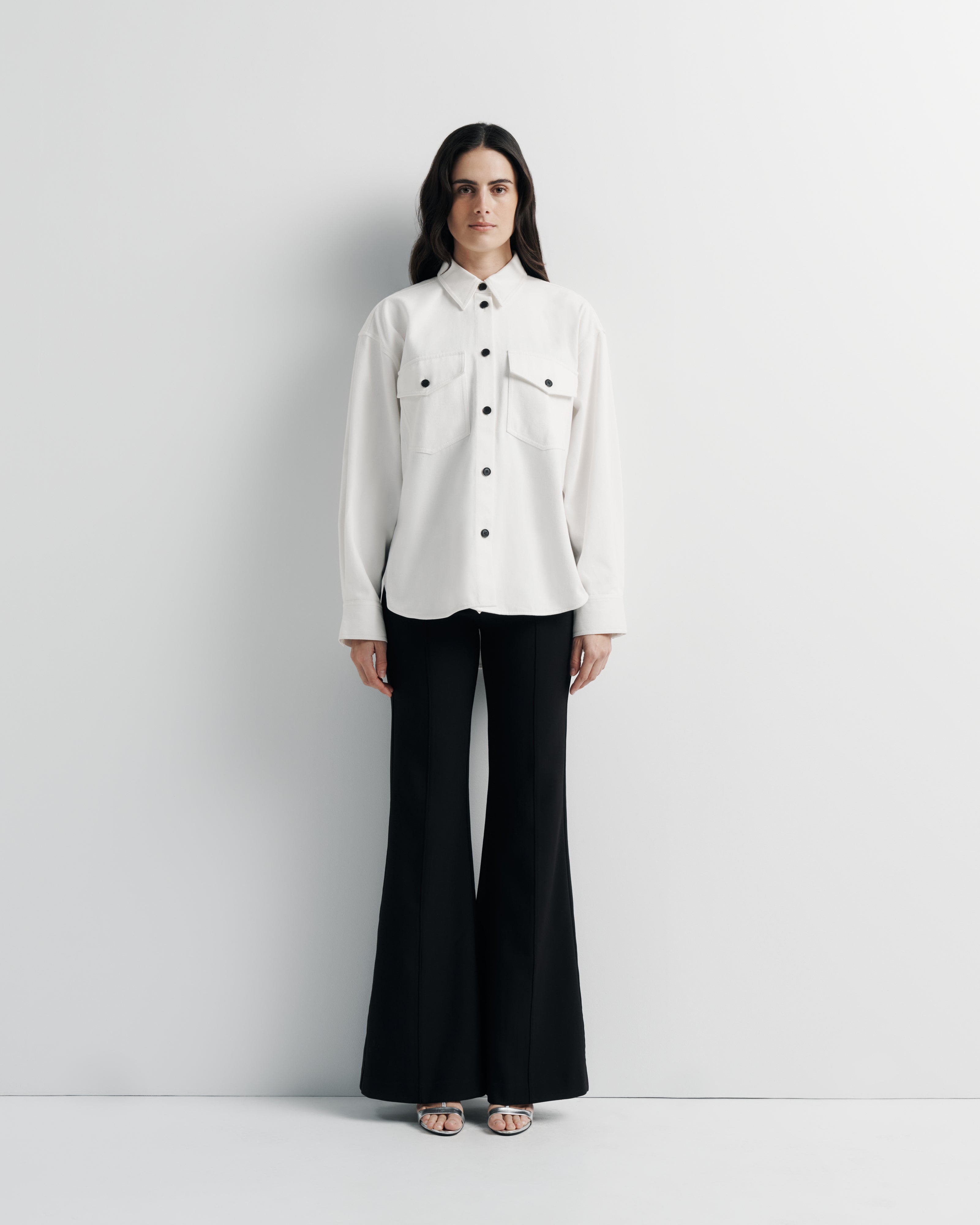 Maggie Jacket – cotton denim shacket with custom buttons and shirt-tail hem by Romy The Brand