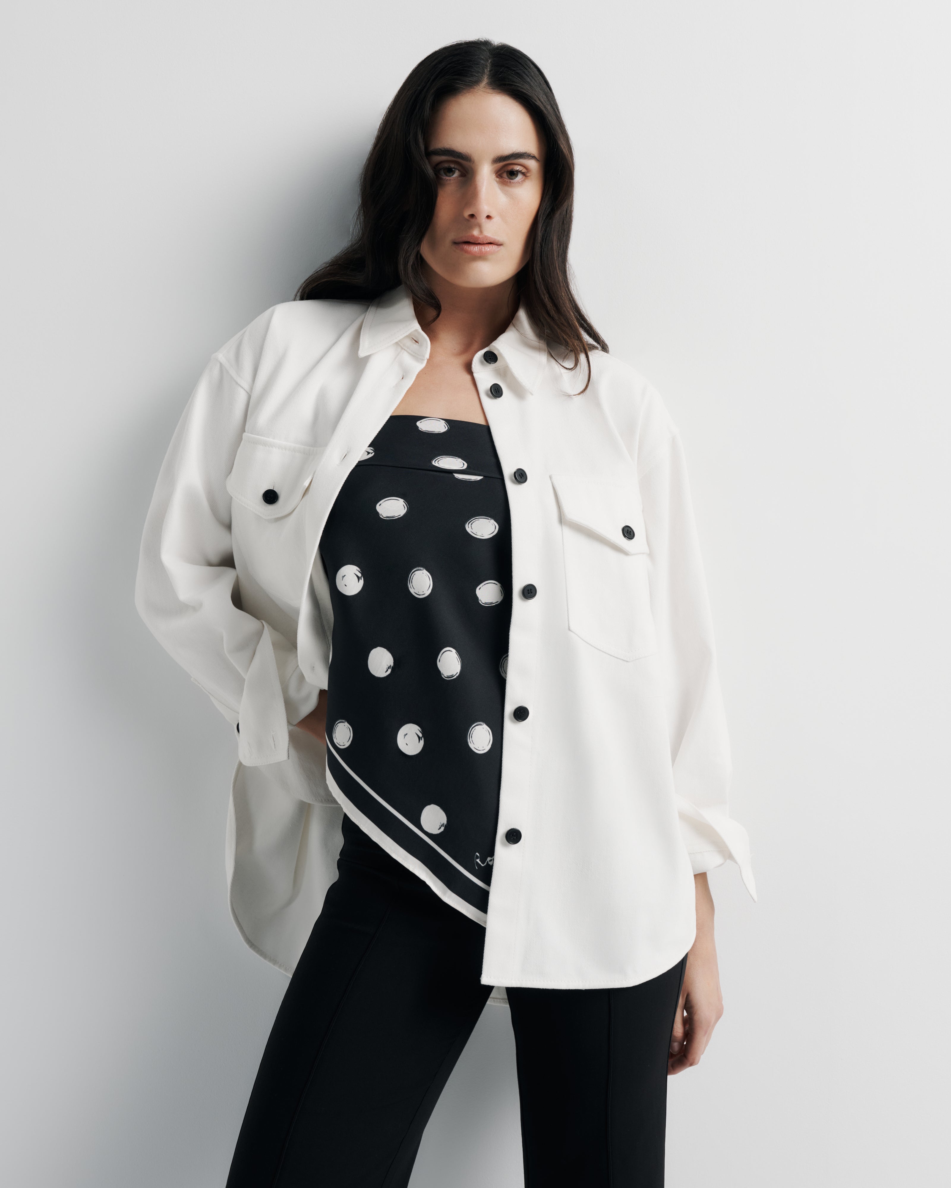Maggie Jacket – cotton denim shacket with custom buttons and shirt-tail hem by Romy The Brand