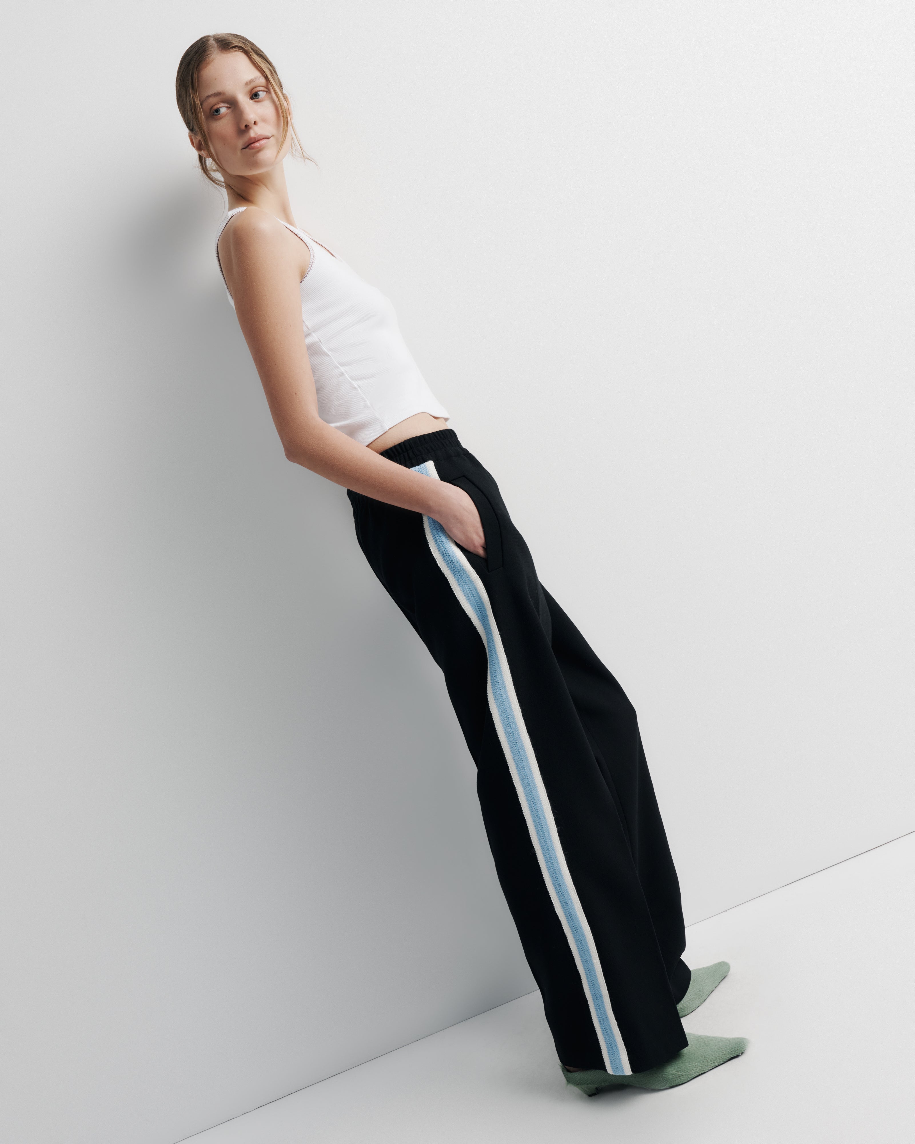 Willa Pant in black – wool track pant with elastic waist and crochet trim by Romy The Brand
