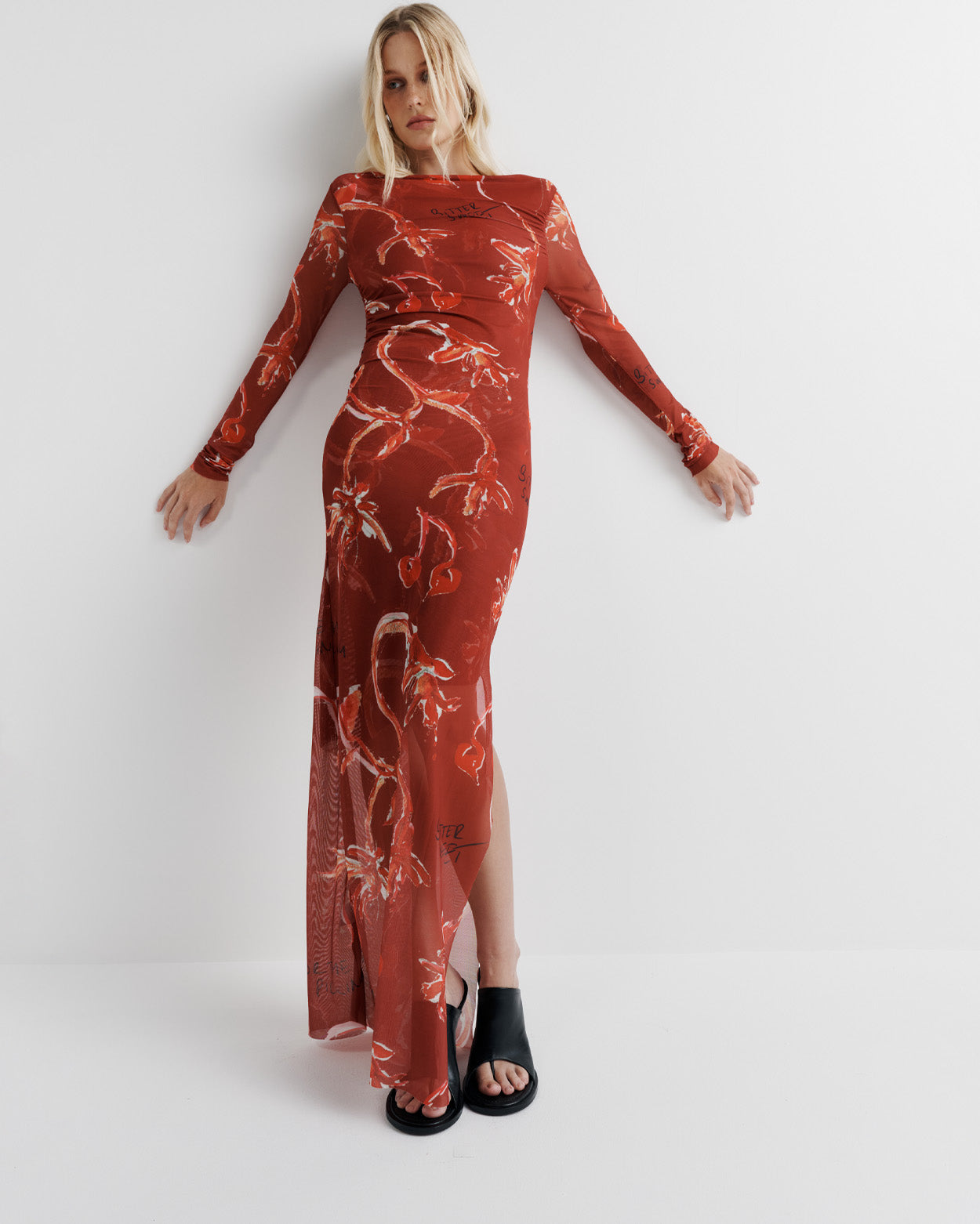 Make a statement in the Sienna Dress – crafted from delicate poly mesh, featuring a half-lined design for the perfect balance of coverage and sheerness. Complete with a side split and long sheer sleeves for an effortlessly elegant look.