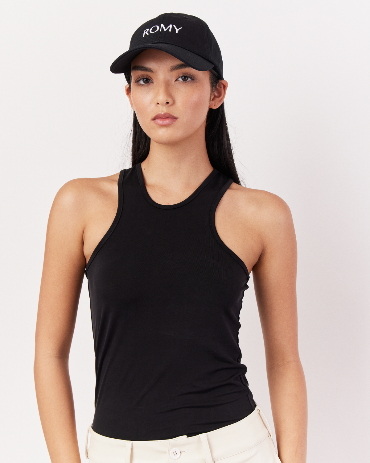 Close-up of Romy Cap in Black with adjustable strap and curved brim for a trendy look