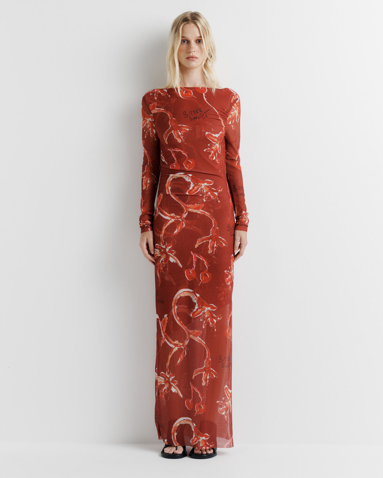 Make a statement in the Sienna Dress – crafted from delicate poly mesh, featuring a half-lined design for the perfect balance of coverage and sheerness. Complete with a side split and long sheer sleeves for an effortlessly elegant look.