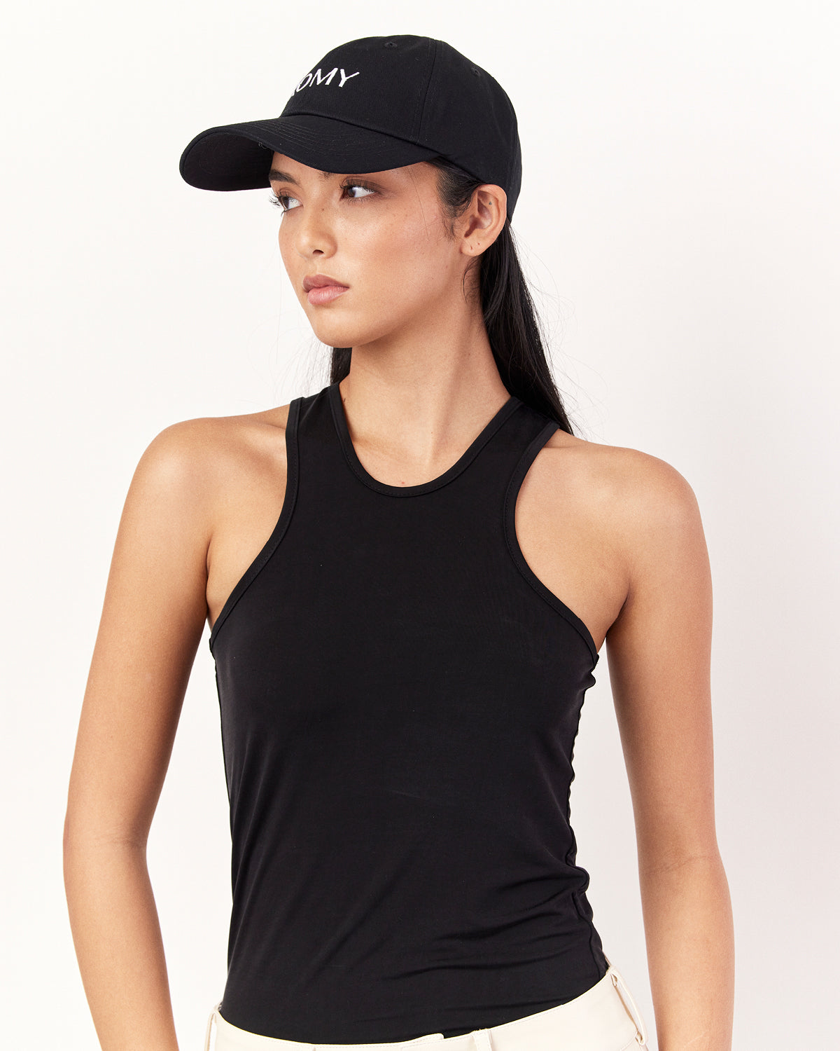 Side view of Romy Cap in Black with embroidered logo and breathable fabric for comfort