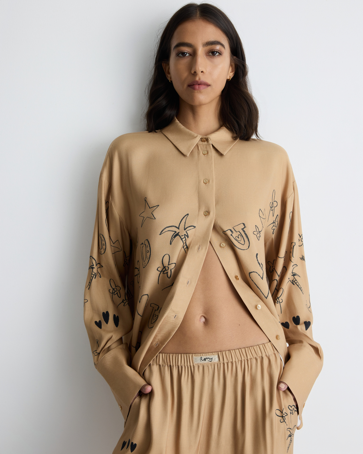 Jakey Shirt in sand with artwork, front close-up on model.