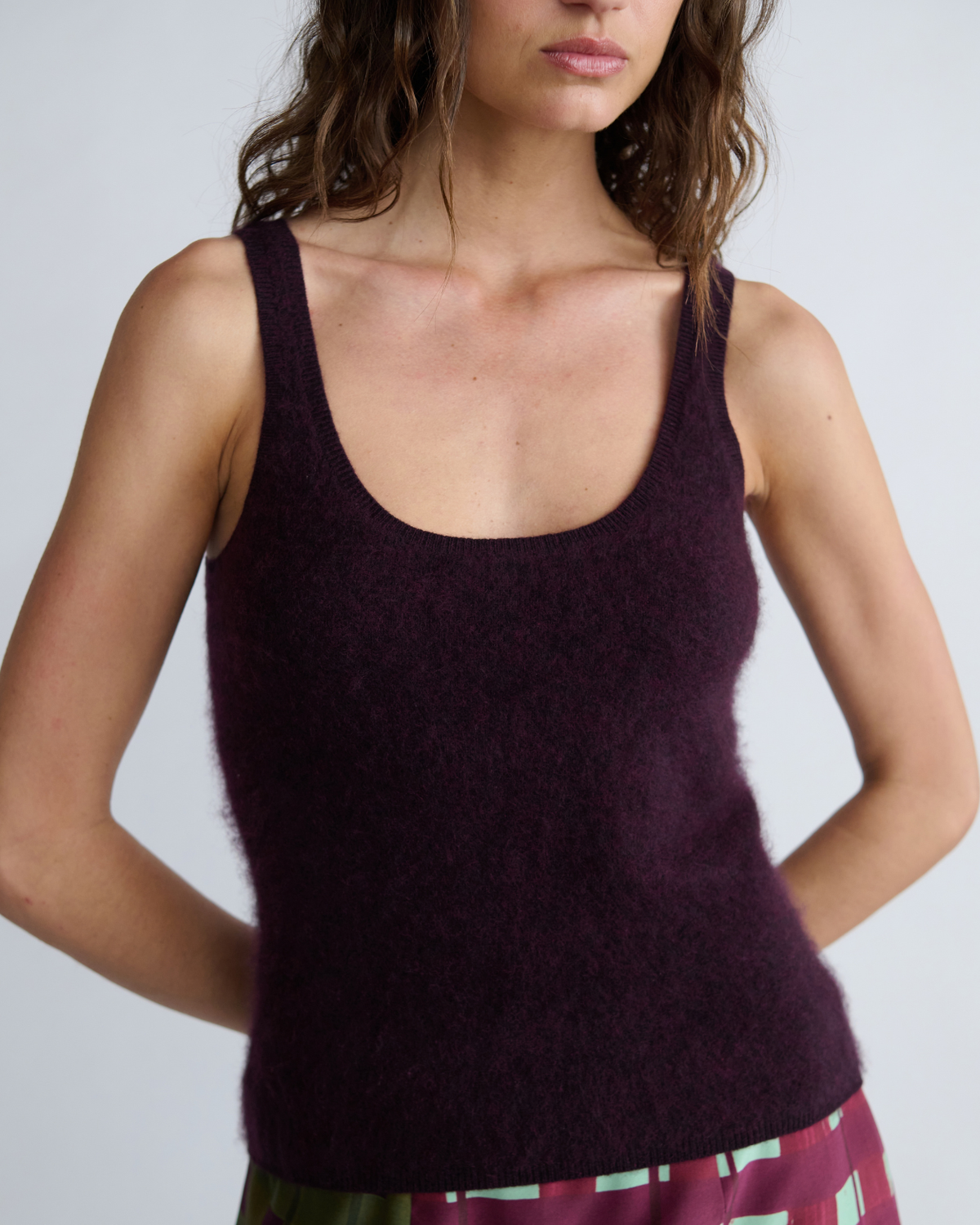 Model wearing the Lucy Knit Tank by ROMY, featuring a sculpted fit and flattering scoop neckline.