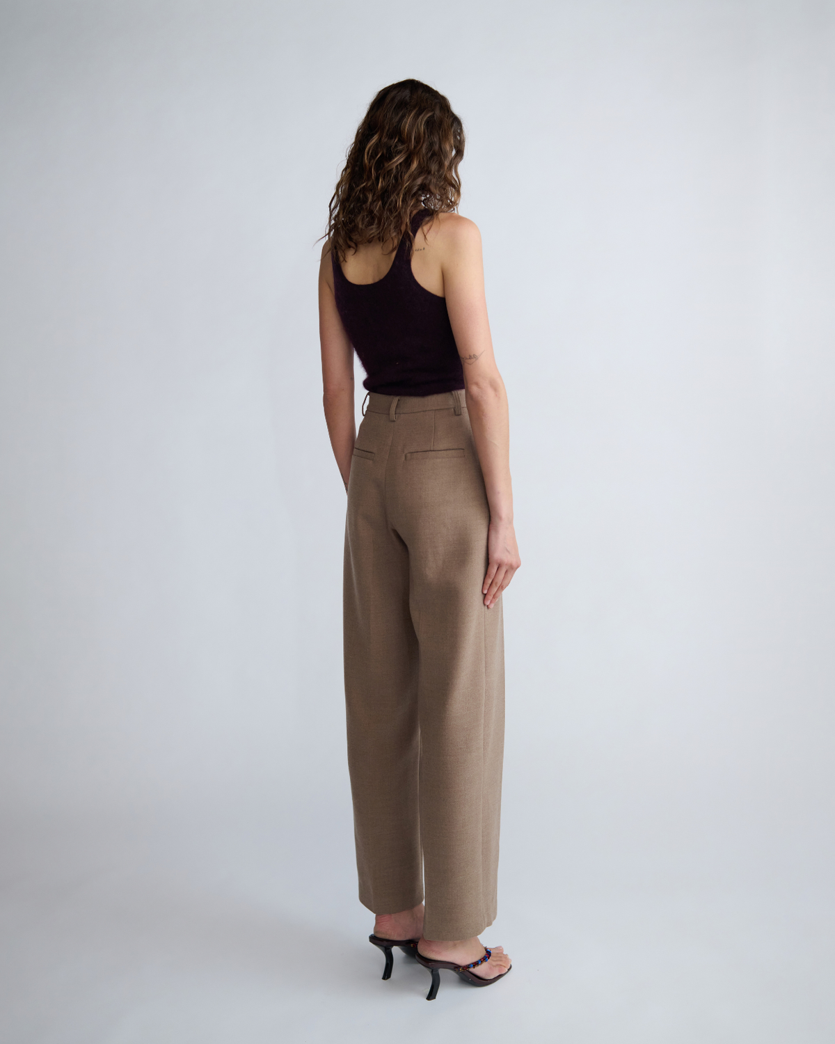 Sloane Pant in fawn, back view on model.