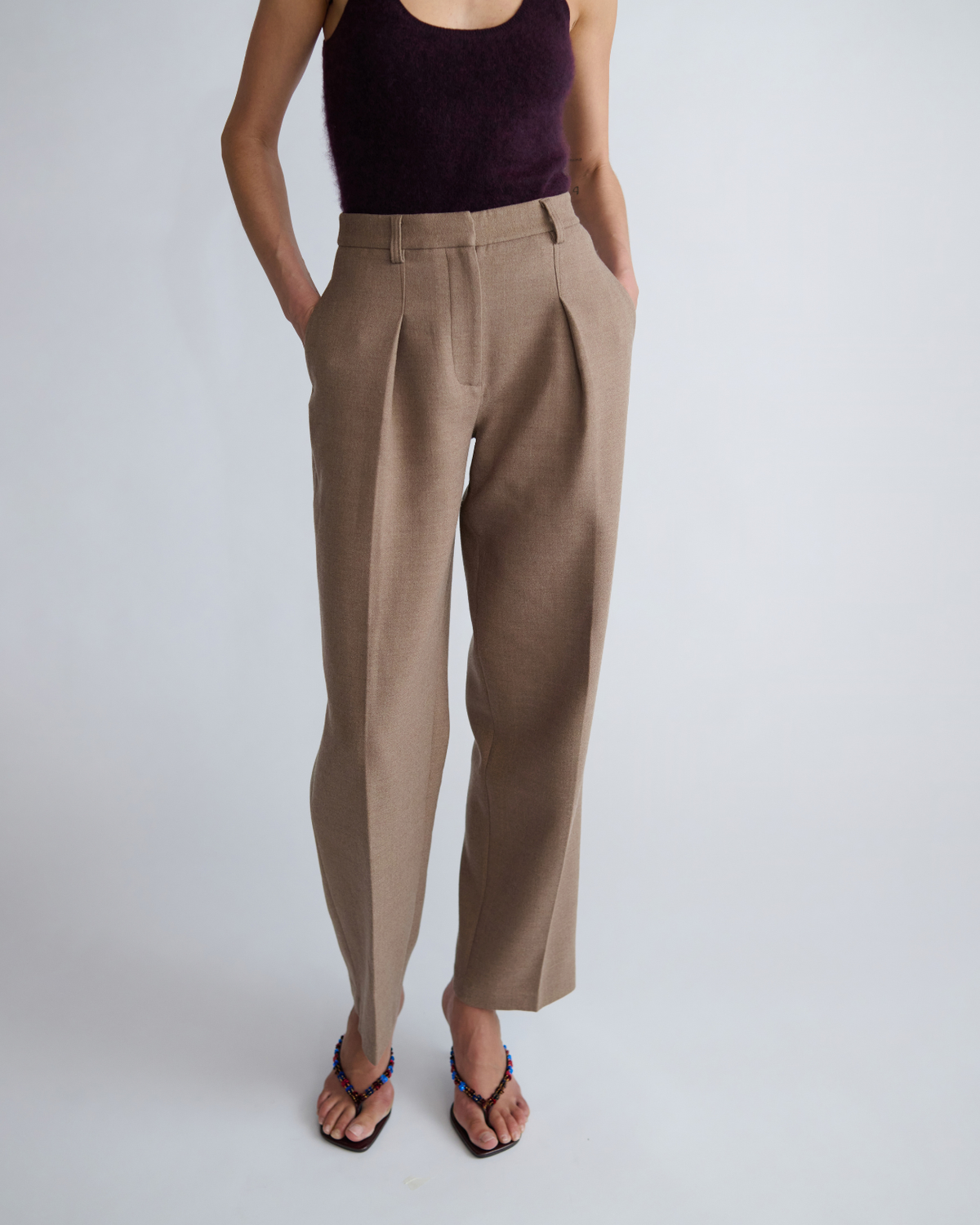 Sloane Pant in fawn, three-quarter view on model.