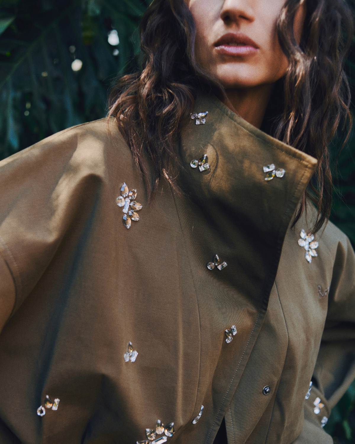 Editorial close-up of the ROMY Forever Jacket highlighting the high funnel collar and crystal beadwork.