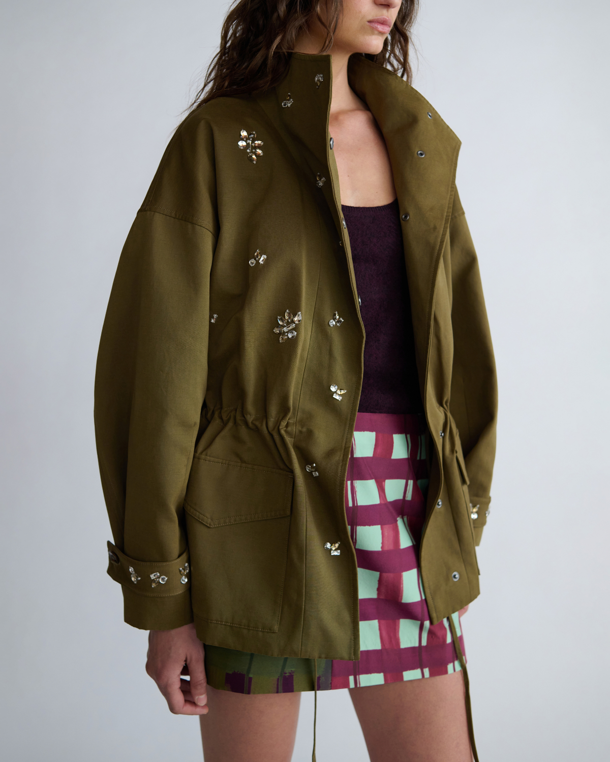 Close-up of the ROMY Forever Jacket worn open, showing crystal embellishments, patch pockets and press studs.