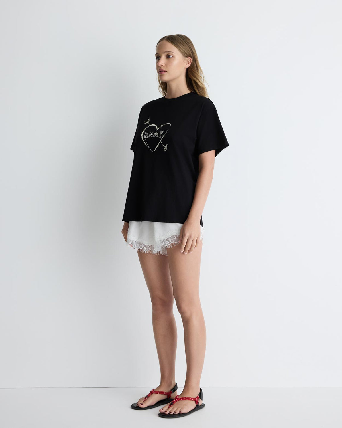 Cupid's Heart Tee in black, three-quarter view on model.