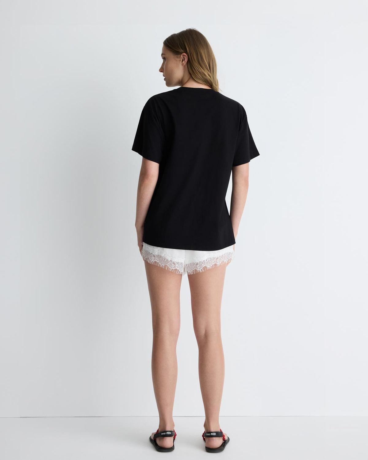 Cupid's Heart Tee in black, back view on model.