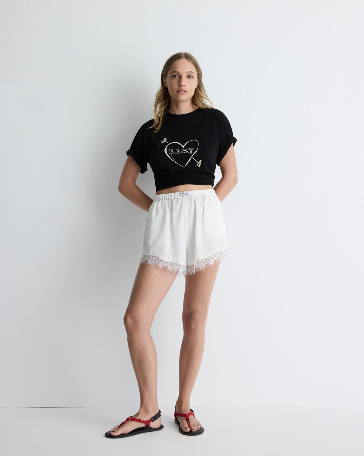Paris Shorts in white with lace trim, front view on model.