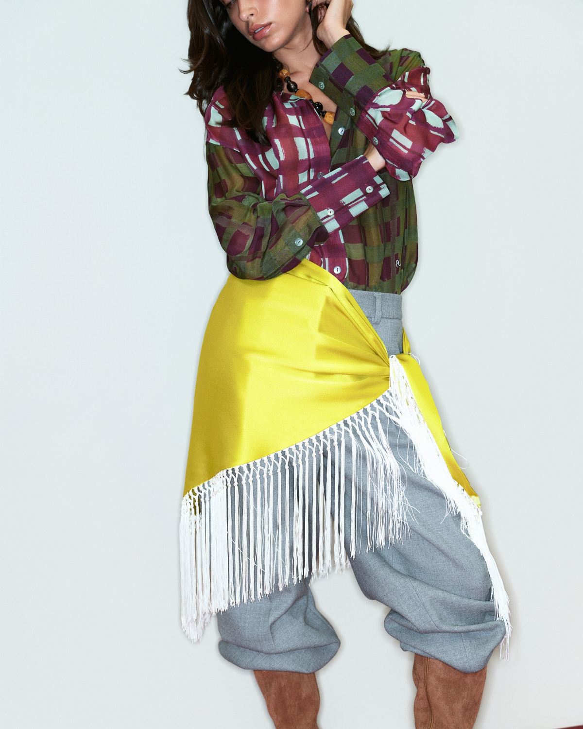 Poppy Fringed Scarf in yellow with cream fringe, styled close-up on model.