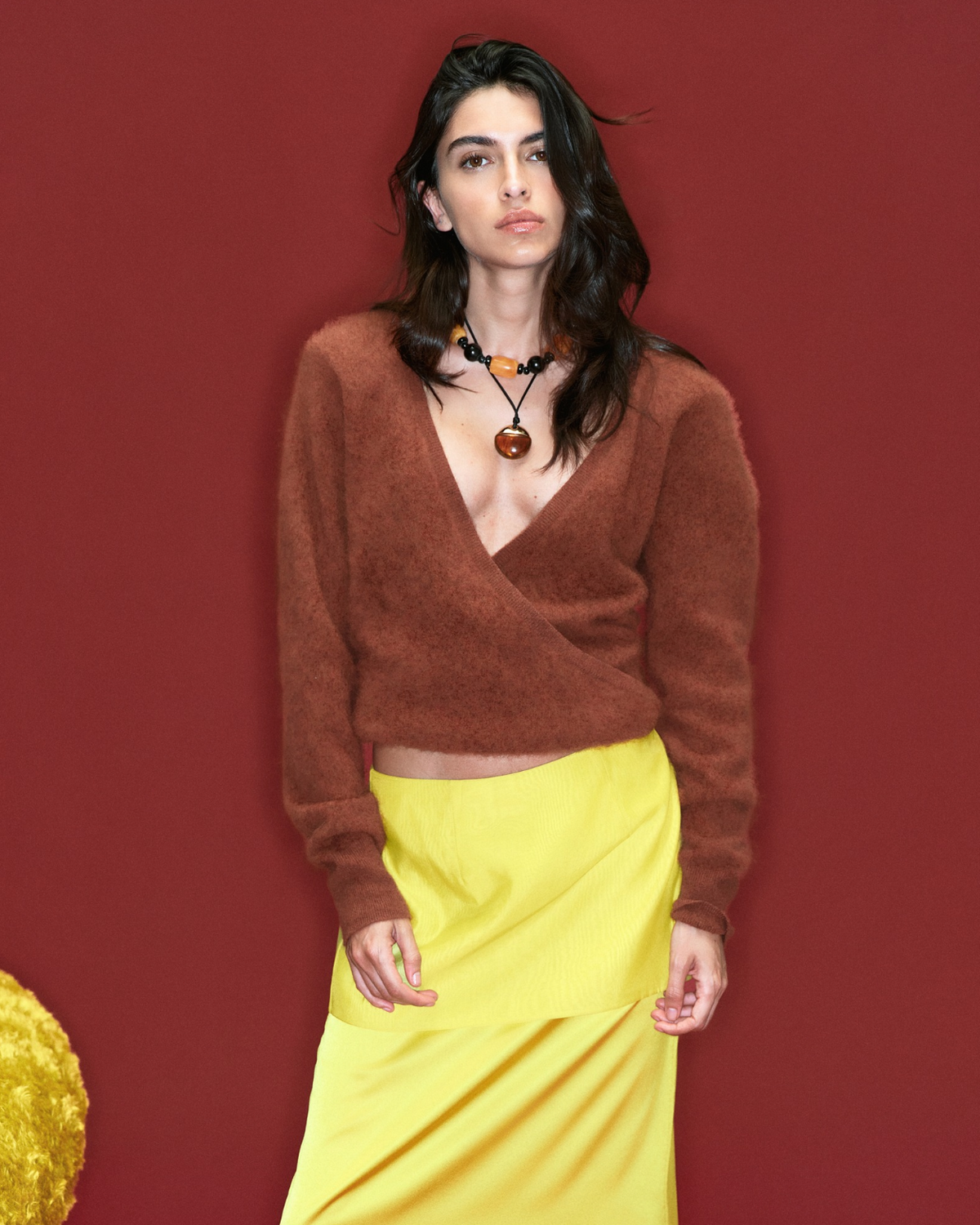 Haven Wrap Sweater in rust brown wool, styled campaign shot.