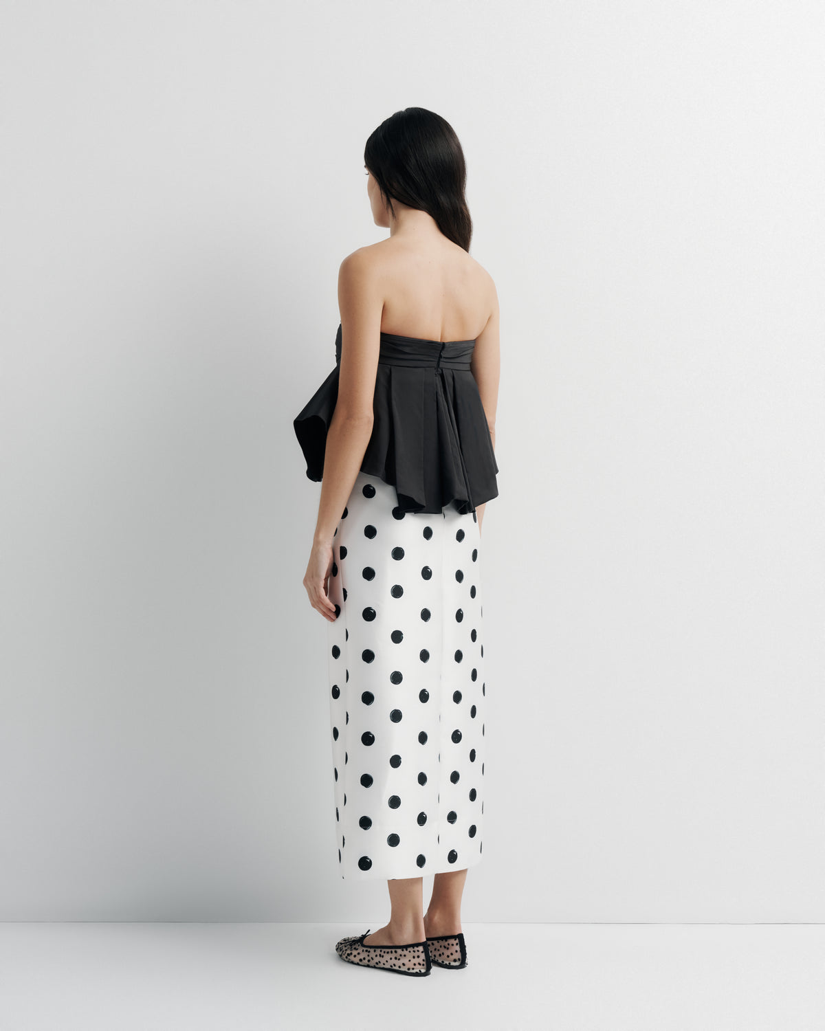 Bella Bustier in black, side view on model.