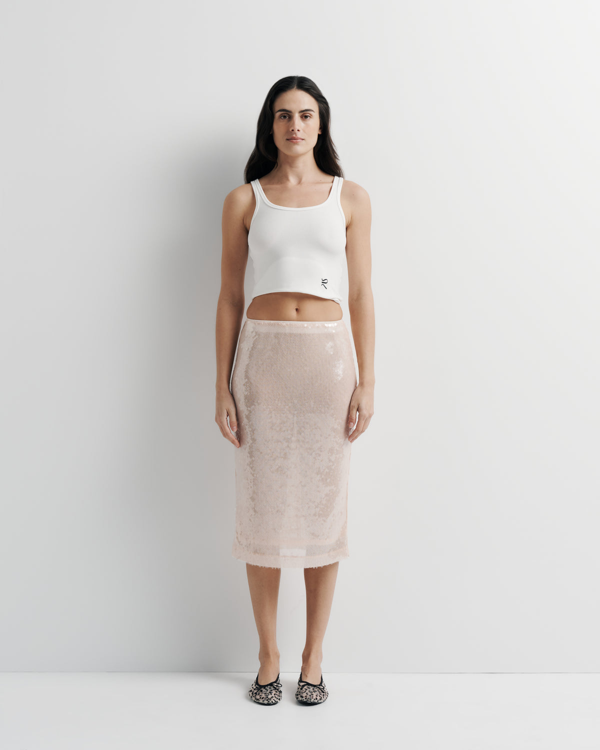 Janey Midi Skirt in pink sequin with polyester mesh lining, front view on model.