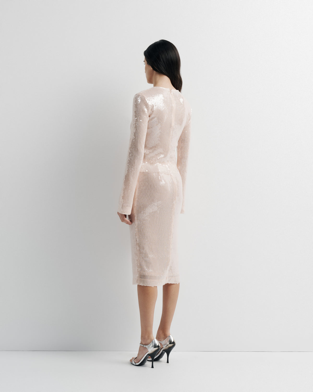 Sara Top in pink sequin with polyester mesh lining, side view on model.