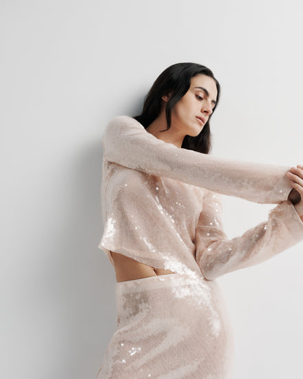 Sara Top in pink sequin with polyester mesh lining, styled close-up on model.
