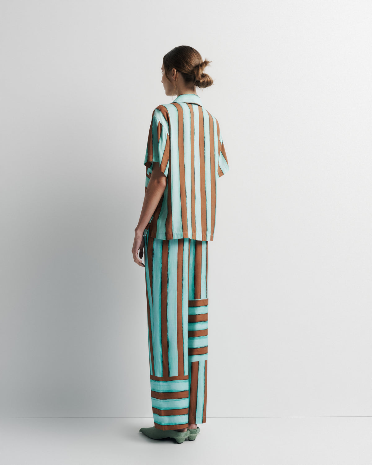 Reese Shirt in aqua and rust hand-painted print, back view on model.