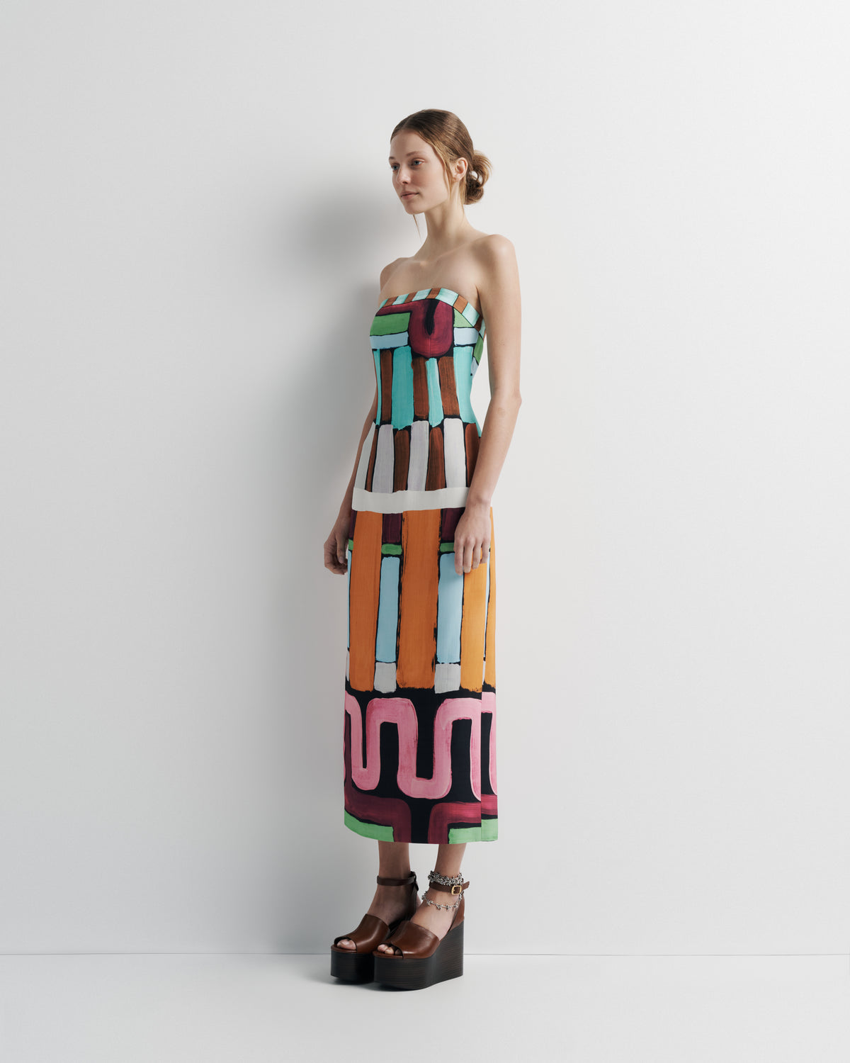 Luna Dress in hand-painted print, three-quarter view on model.