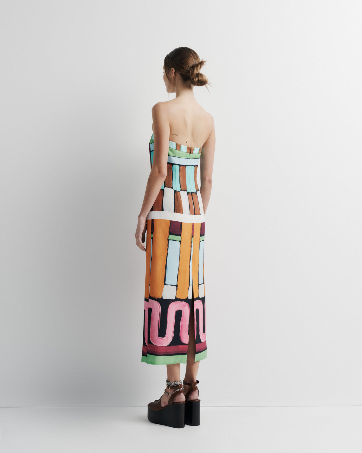 Luna Dress in hand-painted print, back view on model.