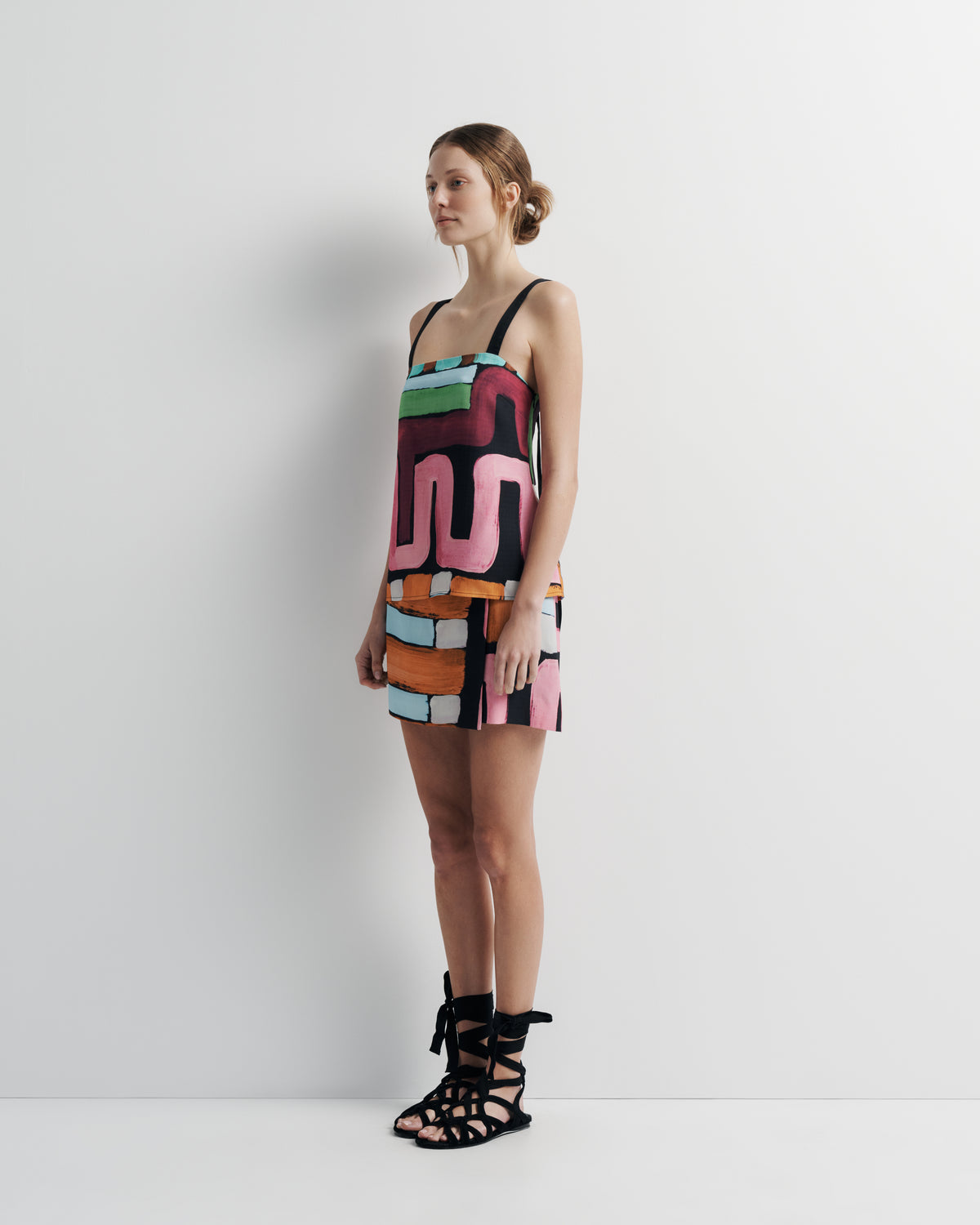 Quinn Top in hand-painted print, three-quarter view on model.