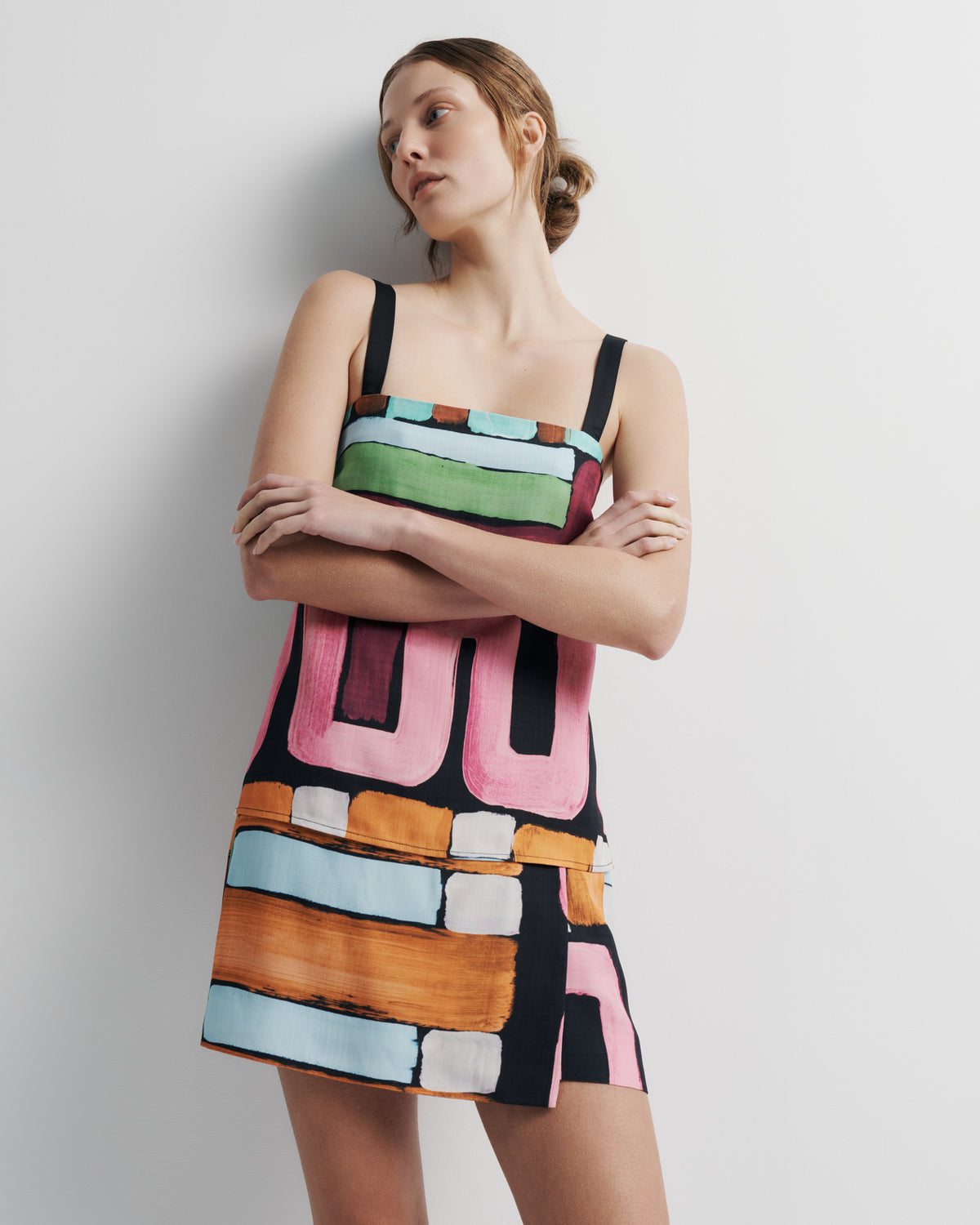 Quinn Top in hand-painted print, styled close-up on model.