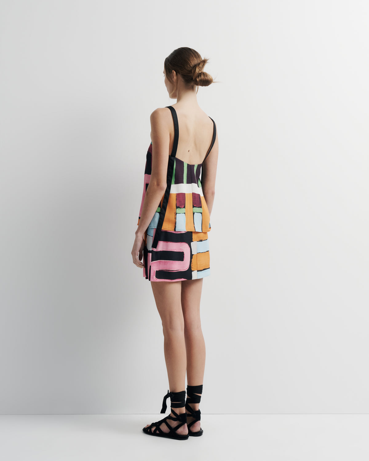 Quinn Top in hand-painted print, back view on model.