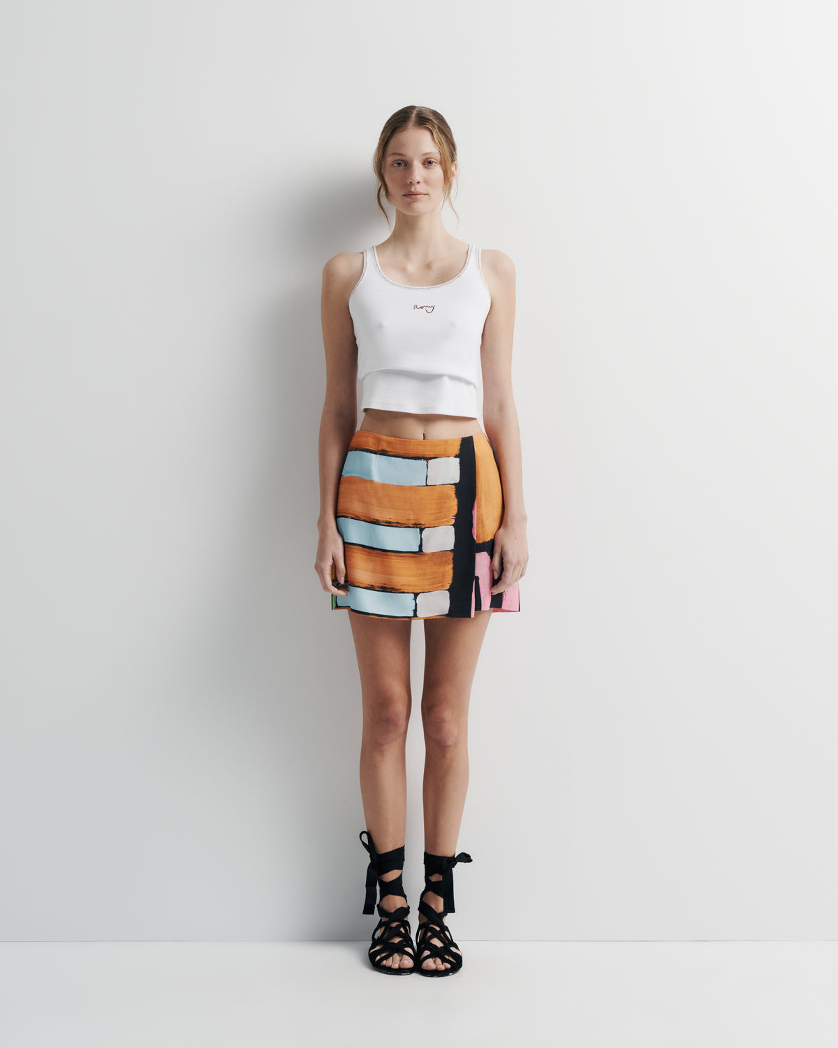 Xena Skirt in hand-painted print, front view on model.