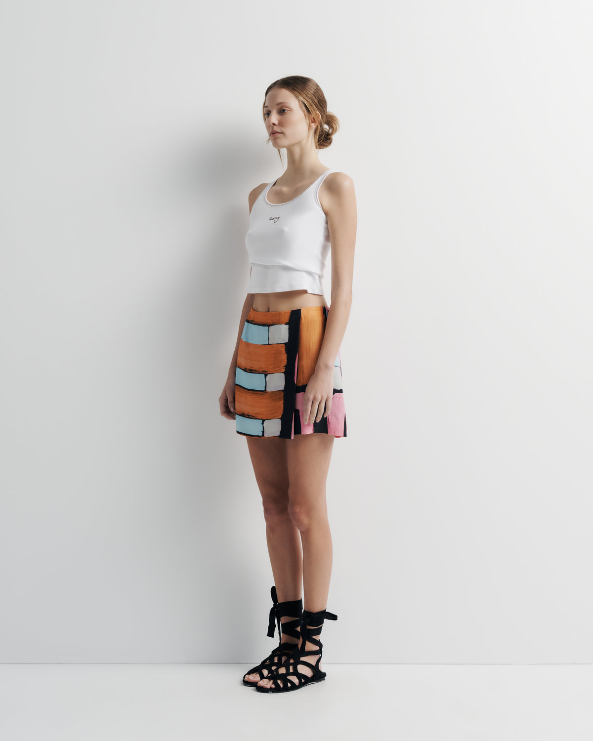 Xena Skirt in hand-painted print, three-quarter view on model.