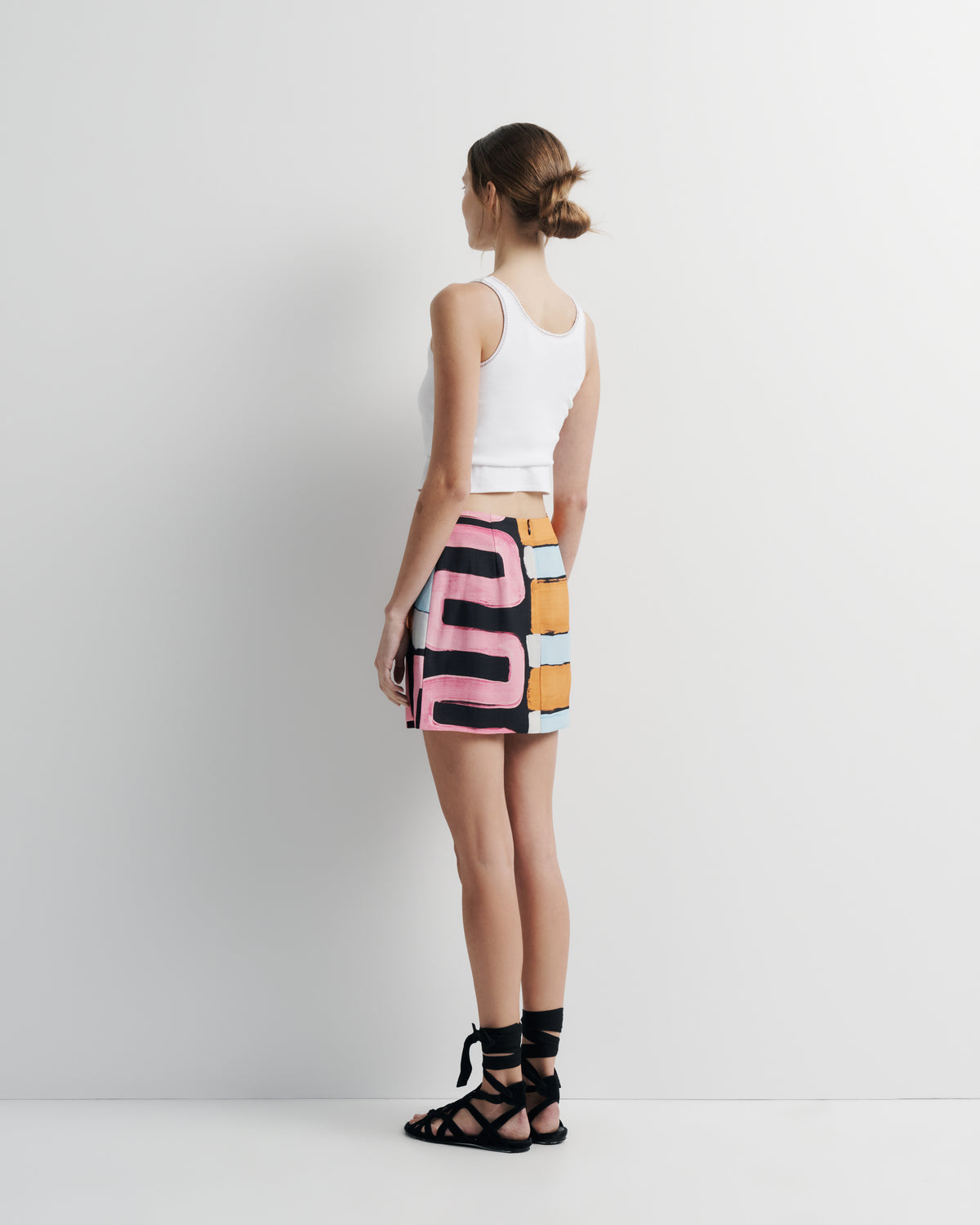 Xena Skirt in hand-painted print, side view on model.