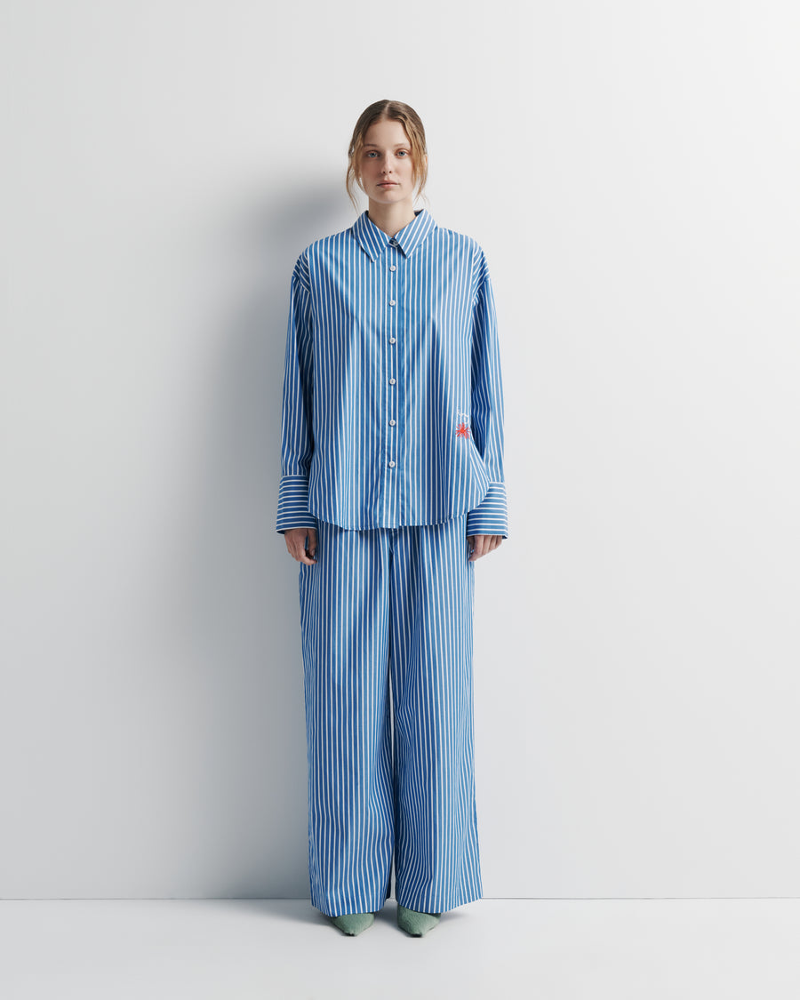 Tara Shirt – oversized 100% cotton shirt with high–low hem, oversized cuffs, and Romy embroidery by Romy The Brand