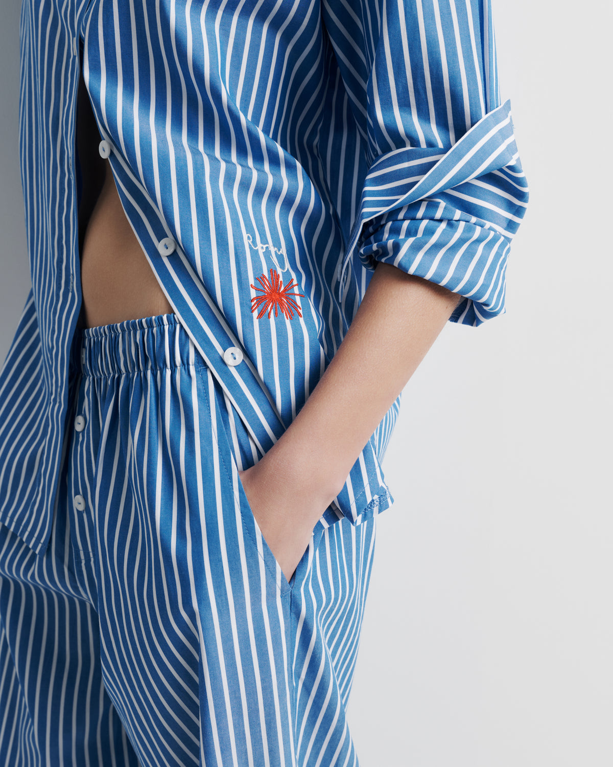 Tara Shirt – oversized 100% cotton shirt with high–low hem, oversized cuffs, and Romy embroidery by Romy The Brand