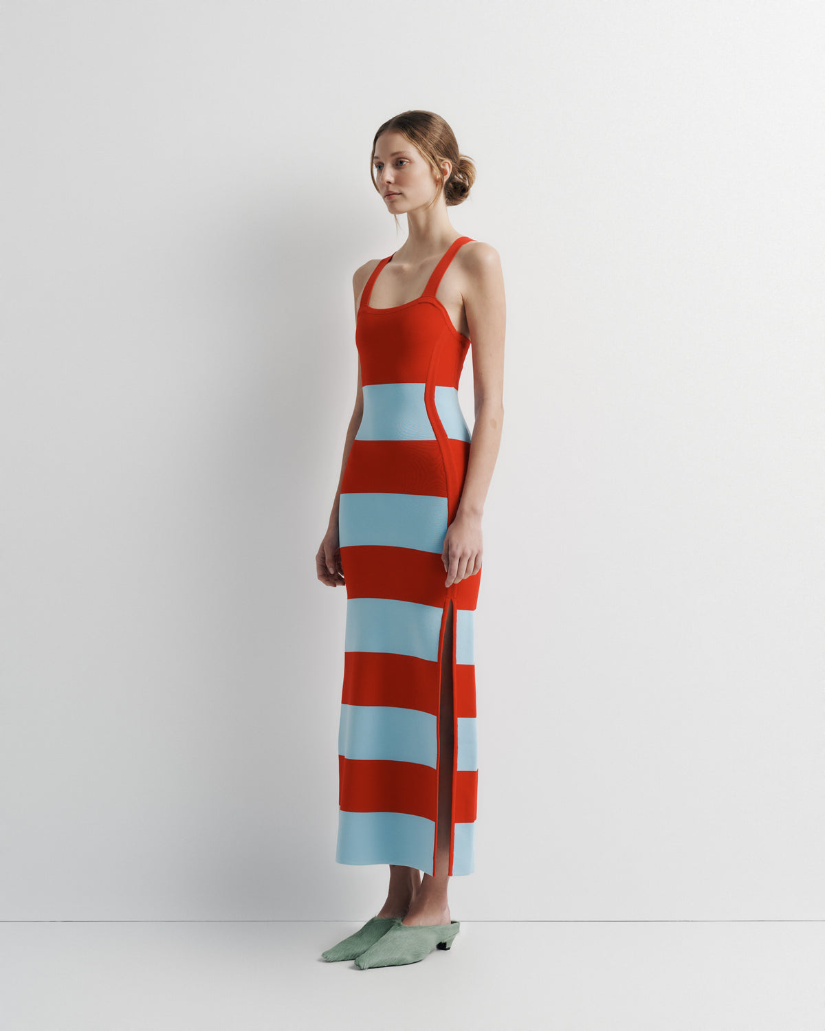 Ava Knit Dress in red and pale blue stripe, three-quarter view on model.