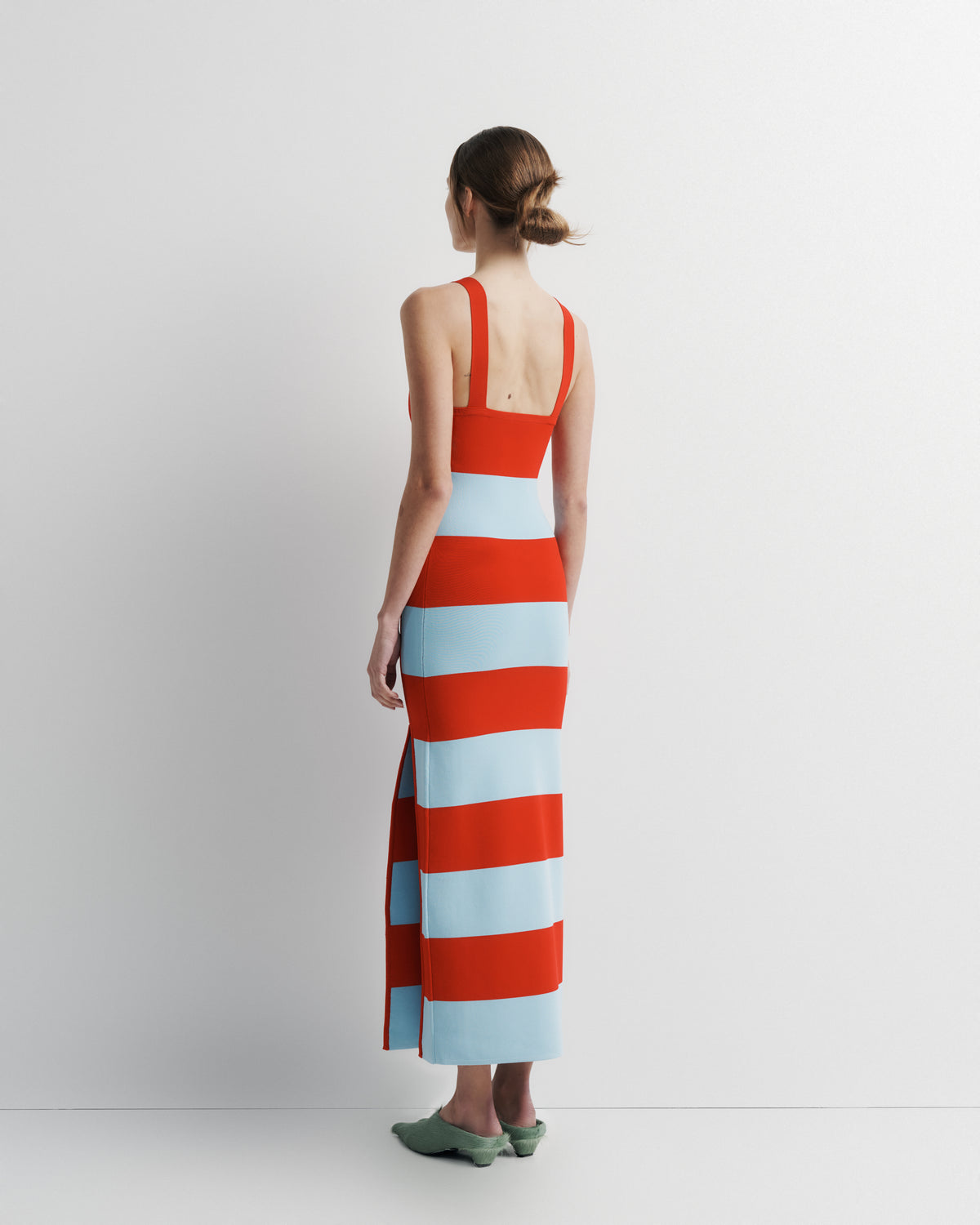 Ava Knit Dress in red and pale blue stripe, back view on model.