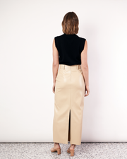 Our best selling, Maxi Suiting Skirt has been recut for Fall in a buttery soft vegan leather. It features belt loops and a back split for ease of wear. Now available at Romy. 