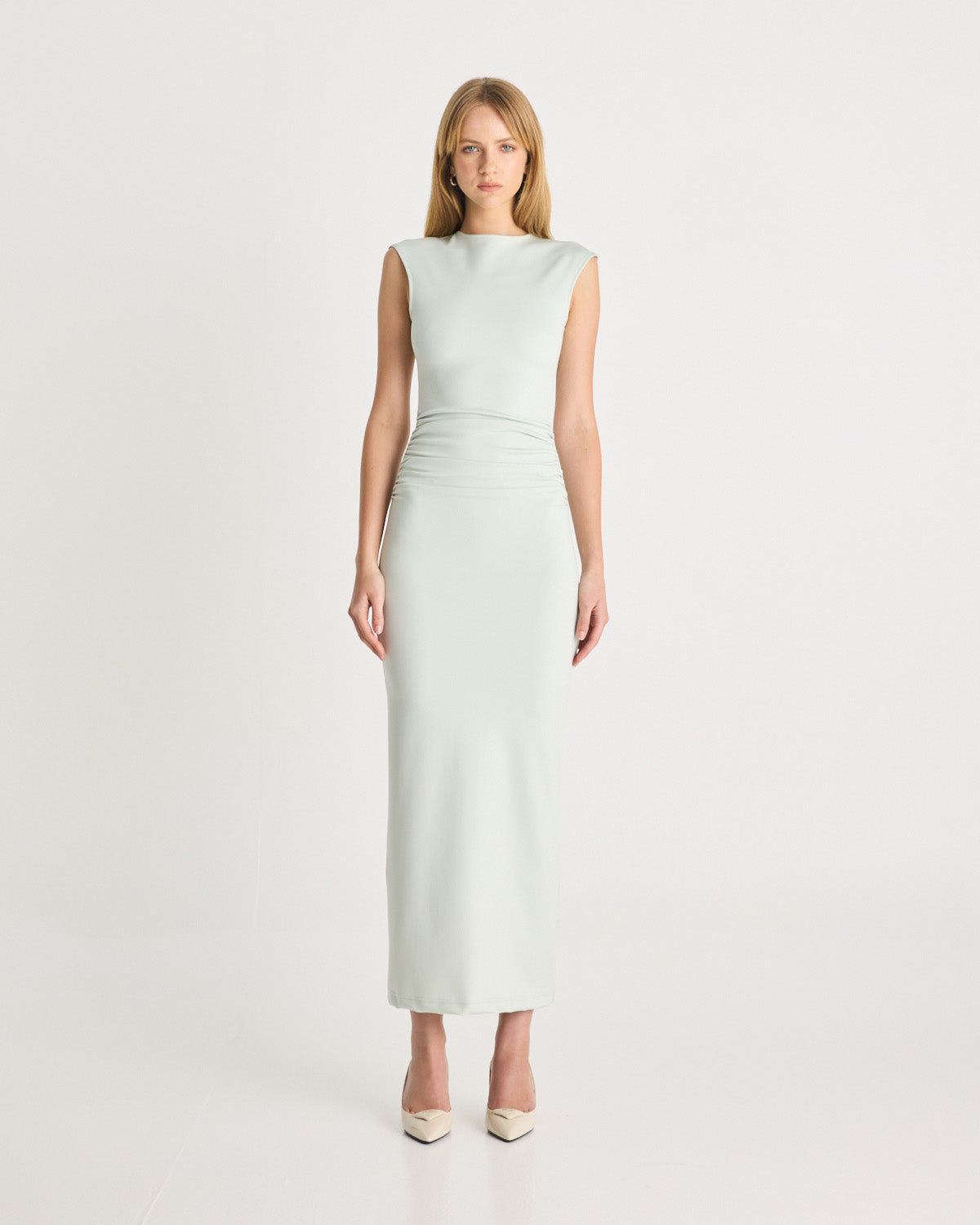 The Scuba Gathered Dress in Mint is a modern event silhouette, ready for your next occasion. It features a crew neckline, gathering through the body, a concealed zip, and a centre back split for ease of wear. Designed to be form-fitting, the Scuba Gathered Dress is crafted from our signature scuba. Shop online at Romy now with Afterpay and free express shipping available.