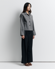 The Gabbi Jacket is a relaxed-fit outerwear piece crafted from soft vegan suede with a contrast pink twill lining. Designed with patch pockets, turn-back cuffs, and a four-button closure for effortless everyday style.