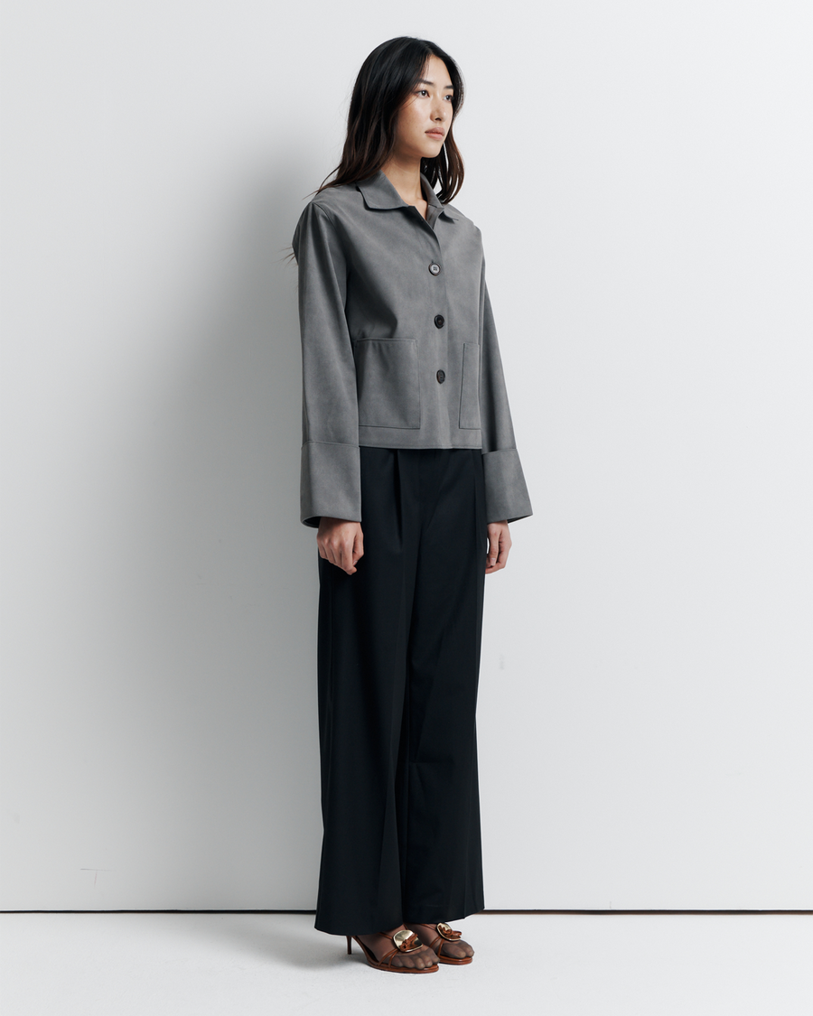 The Gabbi Jacket is a relaxed-fit outerwear piece crafted from soft vegan suede with a contrast pink twill lining. Designed with patch pockets, turn-back cuffs, and a four-button closure for effortless everyday style.