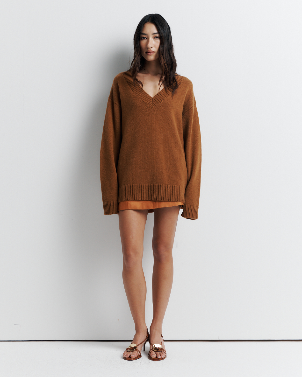 Ingrid Sweater: A relaxed V-neck knit crafted from a soft wool-cashmere blend. Features a slouchy fit with dropped shoulders and chunky ribbing for effortless, everyday comfort. Shop the look now.