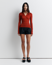 The Louise Knit Top in Red is a collared Henley-style knit featuring soft bust gathers, elongated sleeves for layering, and signature ‘R’ embroidery—an effortlessly polished wardrobe essential.