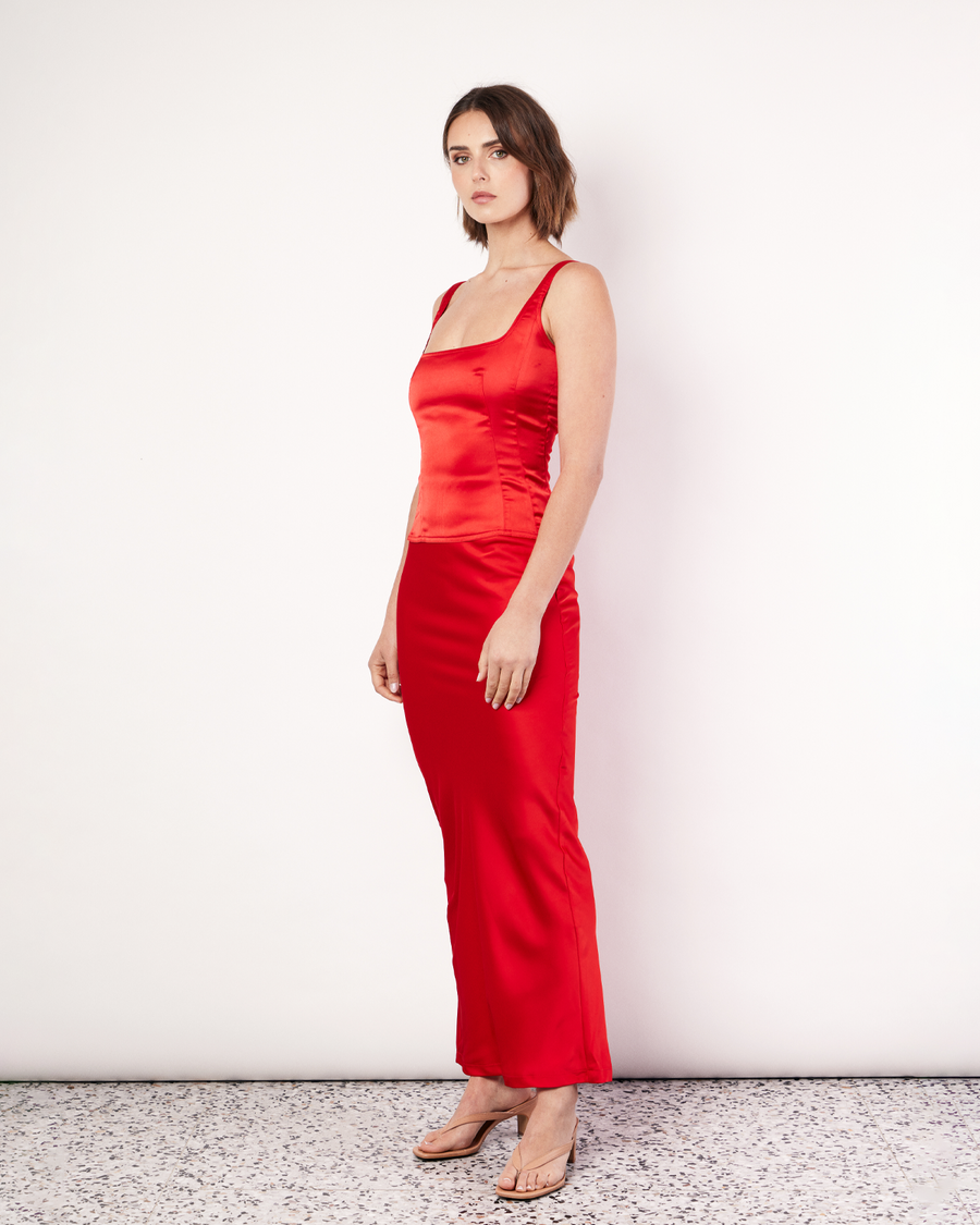 The Satin Tank is crafted from a soft satin fabrication with darts to create a fitted and sculpted feel. Complete the look with the coordinating Satin Maxi Skirt. By Romy, now available. 