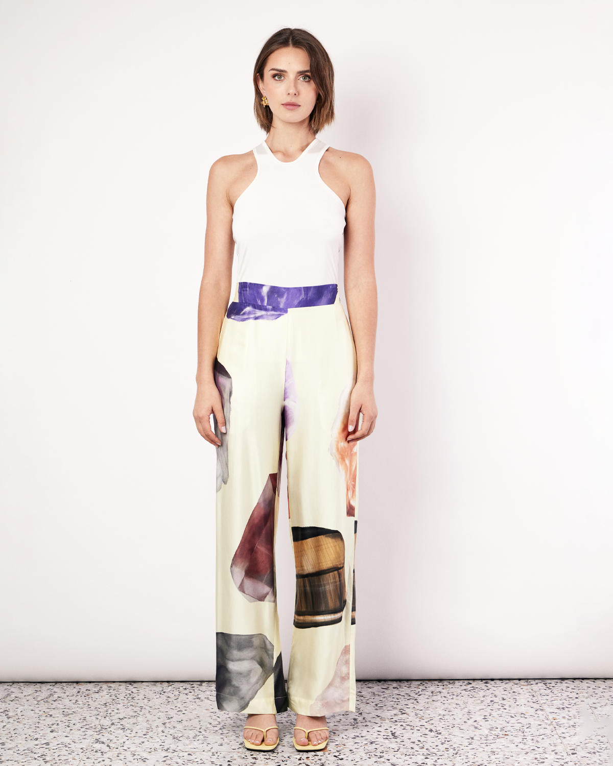 The Gemstone Pant features an updated waistband design that includes a flat band at the front and elastic at the back to flatter the figure. It features side pockets in our signature relaxed straight-leg pant silhouette, offering an elevated yet comfortable style. It is crafted from a silky recycled Oeko-Tex® certified viscose in the Gemstone Print, designed exclusively for Romy. Now available at Romy. 