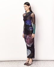 The Gemstone Long Sleeve Mesh Maxi Dress is an elegant and figure hugging silhouette. It is crafted with an ultra-soft mesh fabrication that is opaque through the body and sheer through the arms in the opulent Gemstone Print, designed exclusively for Romy. Print placement will vary. Now available at Romy. 