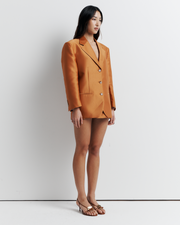 The Gemini Blazer offers a menswear-inspired, oversized silhouette with a three-button closure and jetted pockets, combining classic style with modern ease. Shop now for a versatile addition to your wardrobe!