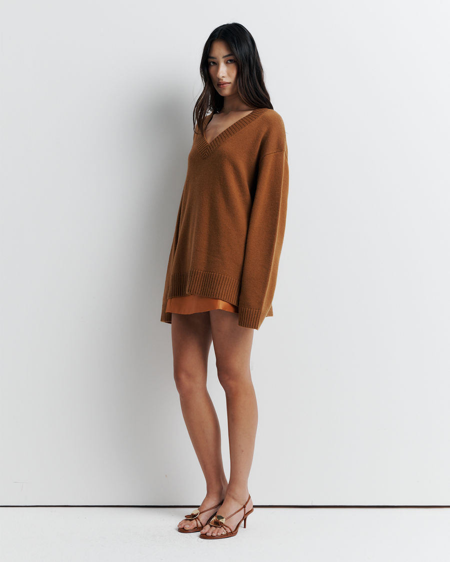Ingrid Sweater: A relaxed V-neck knit crafted from a soft wool-cashmere blend. Features a slouchy fit with dropped shoulders and chunky ribbing for effortless, everyday comfort. Shop the look now.
