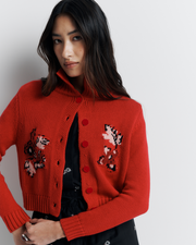 The Lara Cardigan is a fitted, collared knit featuring delicate floral motifs and a timeless button-front design—perfect for layering with a touch of vintage charm.