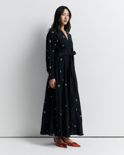 The Lola Shirt Dress is a lightweight, button-through shirtdress featuring pleated waist detailing, a removable belt, and delicate floral embroidery for a romantic, feminine finish.