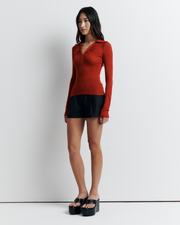 The Louise Knit Top in Red is a collared Henley-style knit featuring soft bust gathers, elongated sleeves for layering, and signature ‘R’ embroidery—an effortlessly polished wardrobe essential.