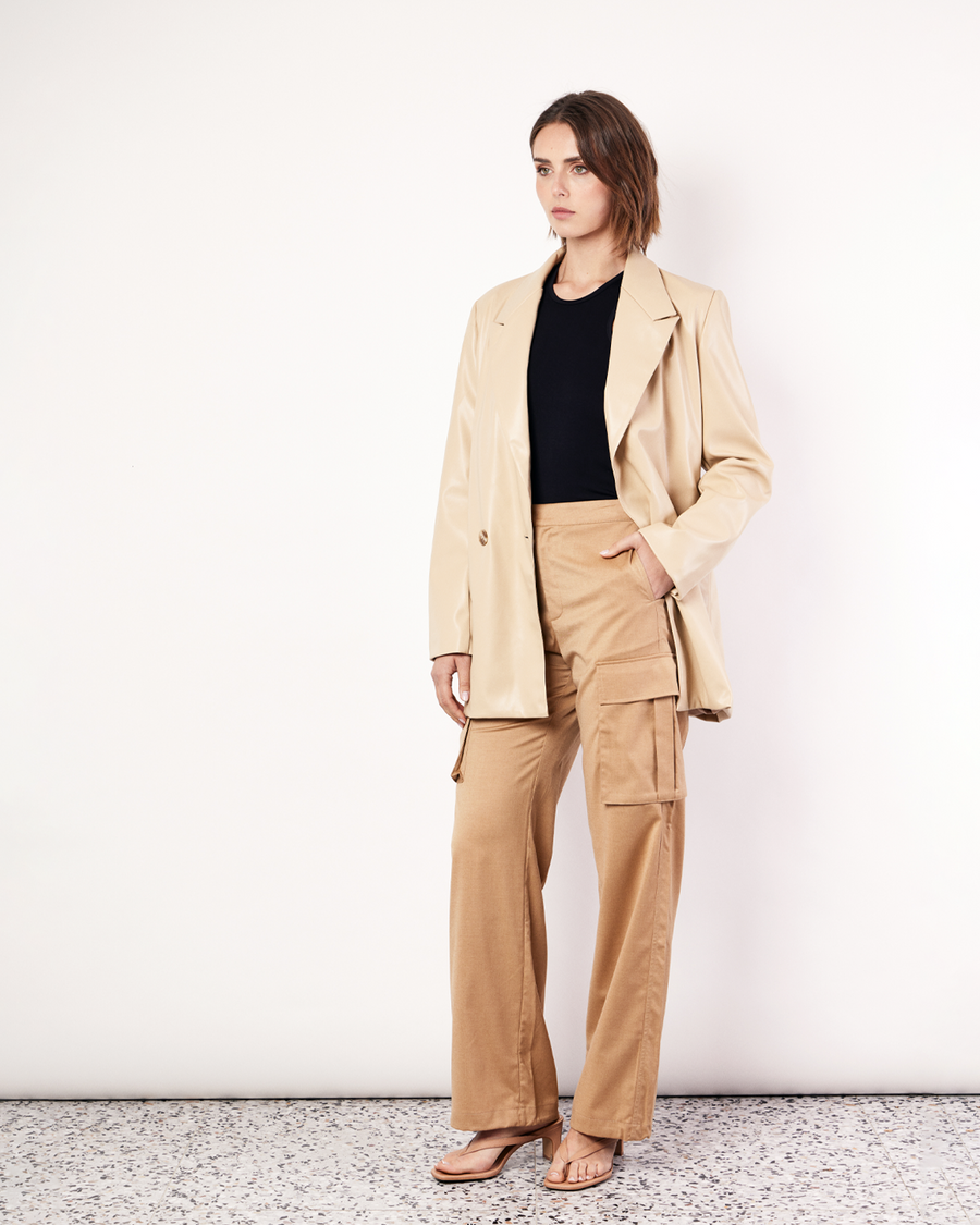 Refined and versatile, our Boxy Vegan Leather Blazer embodies timeless sophistication with a contemporary twist. Crafted from our signature buttery vegan leather, its oversized silhouette exudes effortless style. The smooth texture adds a touch of refinement, making it a must-have for any wardrobe. To achieve the perfect fit, we recommend sizing down for a more tailored look or sticking to your regular size for an oversized feel. Now available at Romy. 